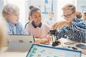 Tweens working together on a robot